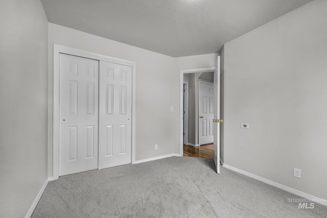 2943 S Zach Pl, Boise, ID 83706 - unfurnished bedroom with carpet, baseboards, a closet, and a textured ceiling