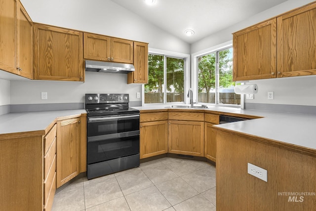 2943 S Zach Pl, Boise, ID 83706 - kitchen with electric stove, a sink, under cabinet range hood, vaulted ceiling, and light countertops