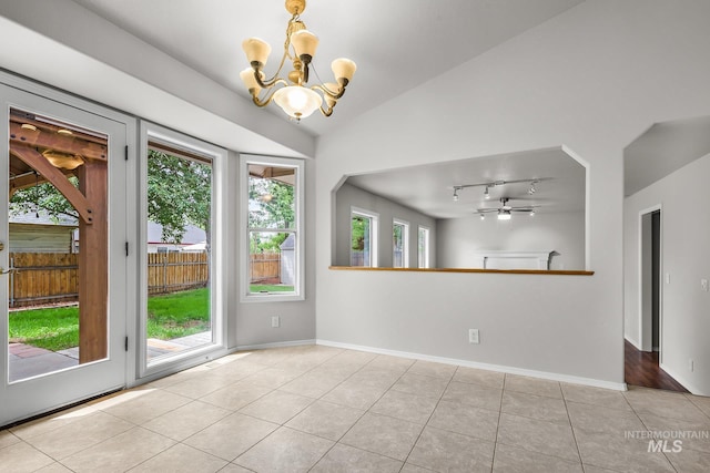 2943 S Zach Pl, Boise, ID 83706 - tiled spare room with a chandelier, vaulted ceiling, baseboards, and ceiling fan
