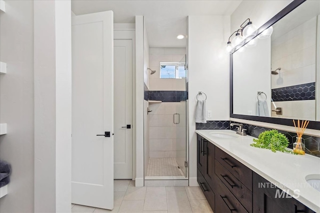 3268 S Sedgebrook Ln, Eagle, ID 83616 - bathroom with double vanity, a sink, tile patterned flooring, and a shower stall
