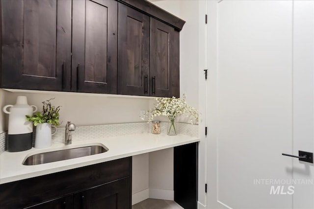 3268 S Sedgebrook Ln, Eagle, ID 83616 - kitchen with light countertops, a sink, and dark brown cabinets