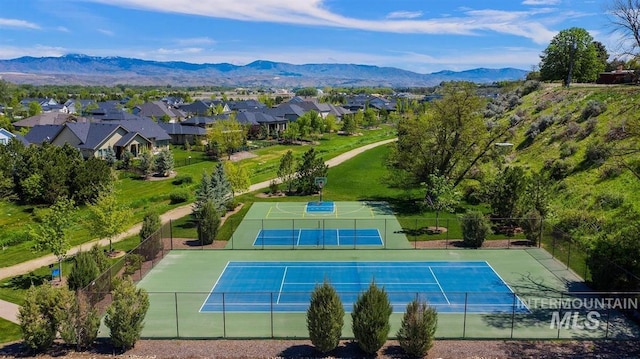 3268 S Sedgebrook Ln, Eagle, ID 83616 - view of tennis court with a residential view, fence, and a mountain view