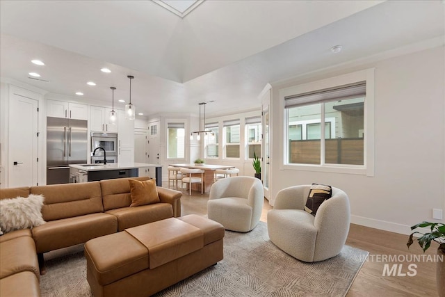3268 S Sedgebrook Ln, Eagle, ID 83616 - living room featuring light wood-type flooring, baseboards, and recessed lighting