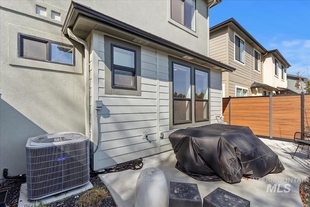 3268 S Sedgebrook Ln, Eagle, ID 83616 - view of patio / terrace with central air condition unit, area for grilling, and fence