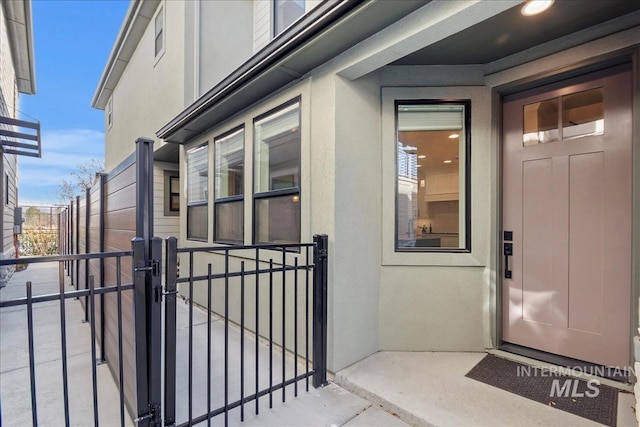 3268 S Sedgebrook Ln, Eagle, ID 83616 - property entrance featuring stucco siding and a gate
