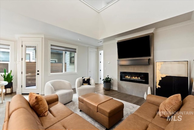 3268 S Sedgebrook Ln, Eagle, ID 83616 - living room featuring a wealth of natural light, vaulted ceiling, ornamental molding, and a glass covered fireplace