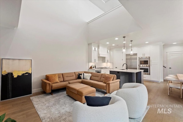 3268 S Sedgebrook Ln, Eagle, ID 83616 - living area with a high ceiling, recessed lighting, baseboards, and light wood-type flooring