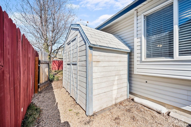 view of shed featuring a fenced backyard