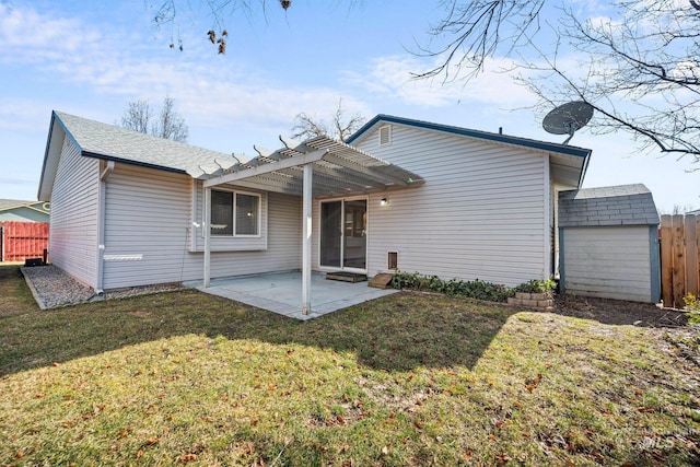 rear view of property featuring a yard, a patio area, fence, and a pergola