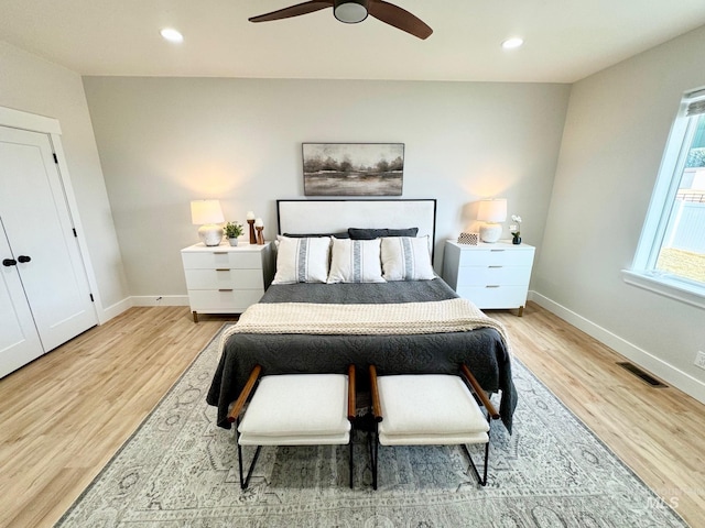 bedroom featuring ceiling fan and light hardwood / wood-style floors