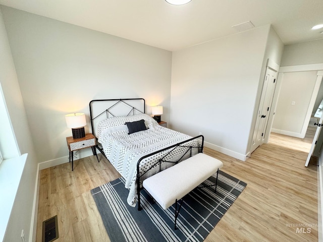 bedroom with wood-type flooring
