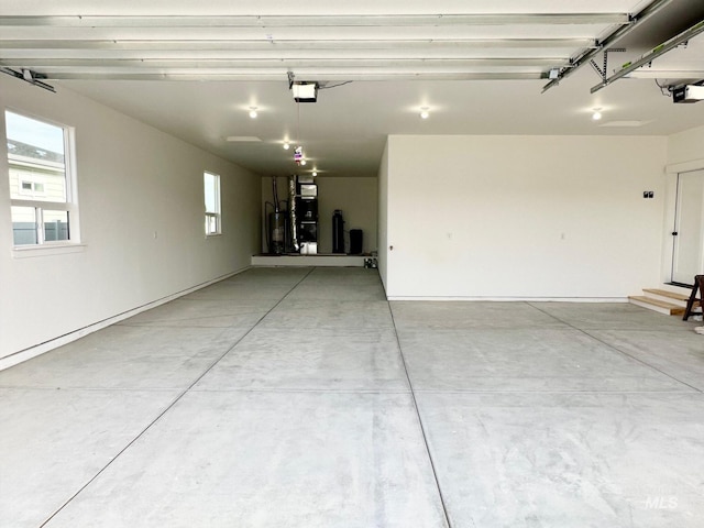 garage with heating unit, a garage door opener, and water heater