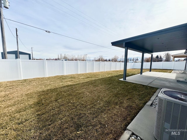view of yard featuring a patio and central AC