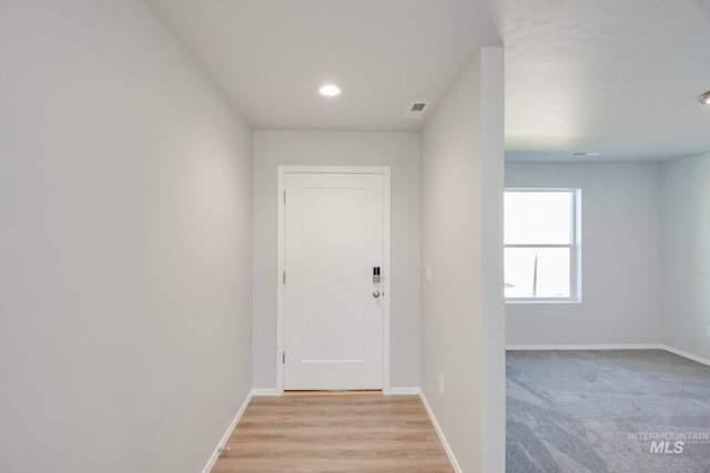 doorway to outside featuring light hardwood / wood-style flooring