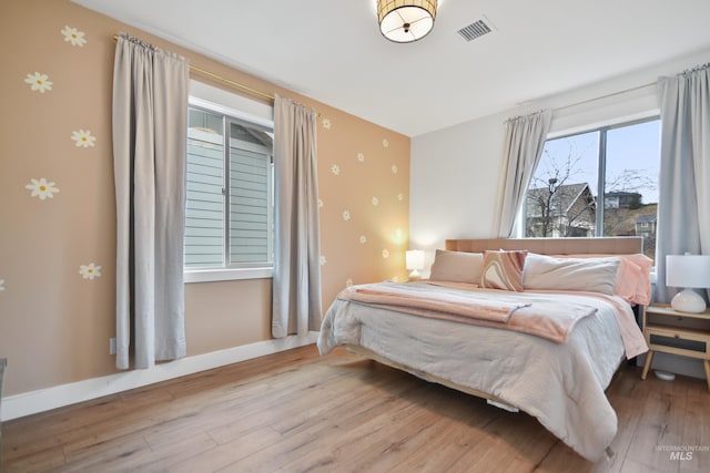 bedroom with light wood-type flooring