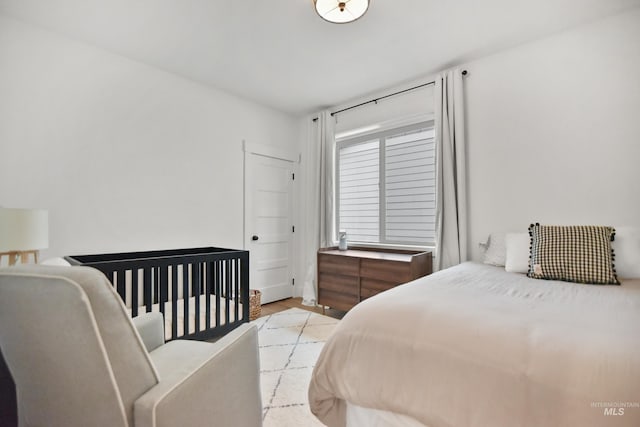 bedroom with light hardwood / wood-style floors