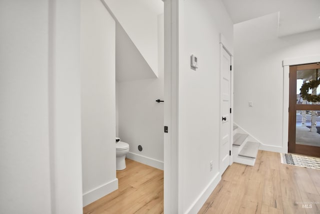 corridor with light wood-type flooring