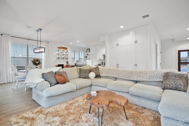 living room with light hardwood / wood-style floors