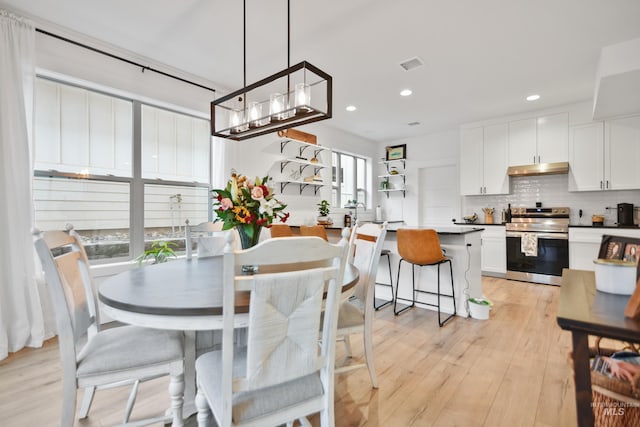 dining room with light hardwood / wood-style floors