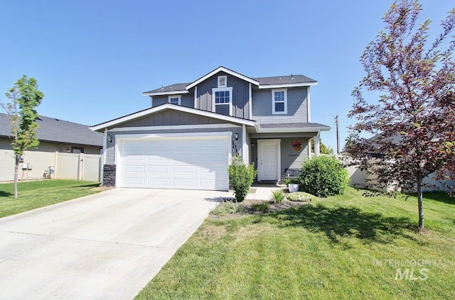 10382 Scout Ridge St, Nampa, ID 83687 - view of front of property with driveway, a garage, and board and batten siding