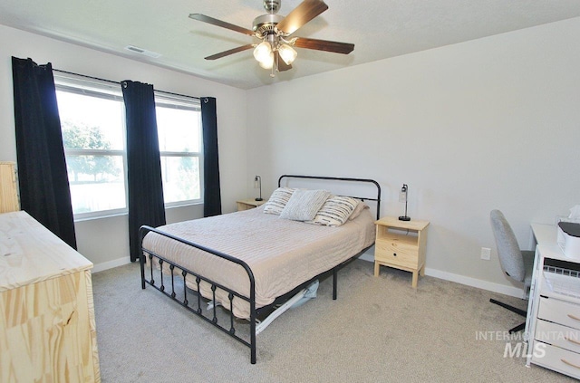 10382 Scout Ridge St, Nampa, ID 83687 - bedroom featuring light carpet, baseboards, and a ceiling fan