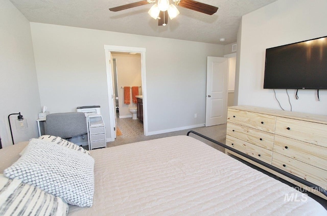 10382 Scout Ridge St, Nampa, ID 83687 - bedroom with carpet, baseboards, ensuite bathroom, and a ceiling fan