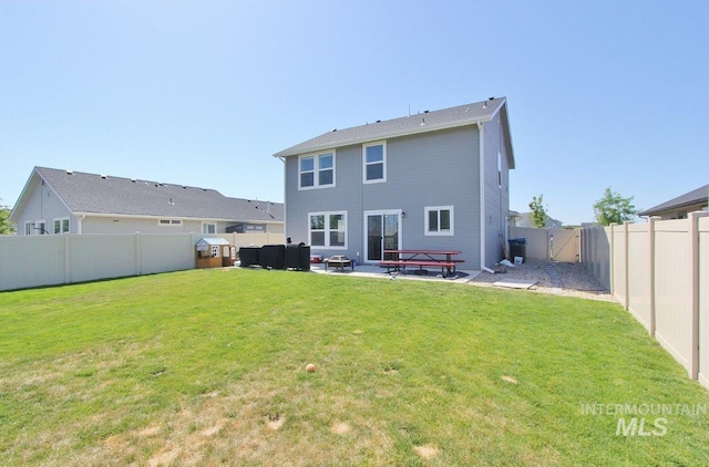 10382 Scout Ridge St, Nampa, ID 83687 - back of house with a gate and a patio