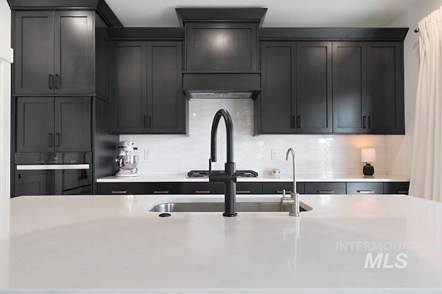 12524 W Shortcreek, Star, ID 83669 - kitchen featuring oven and tasteful backsplash