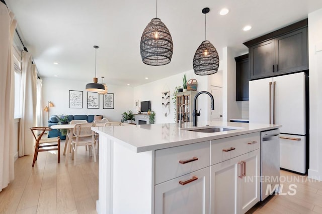 12524 W Shortcreek, Star, ID 83669 - kitchen with dishwasher, light countertops, open floor plan, hanging light fixtures, and recessed lighting
