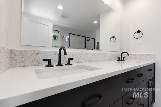 12524 W Shortcreek, Star, ID 83669 - bathroom with double vanity, a shower stall, and recessed lighting