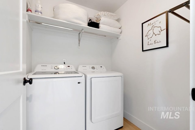 12524 W Shortcreek, Star, ID 83669 - laundry area with washing machine and dryer and light wood-type flooring