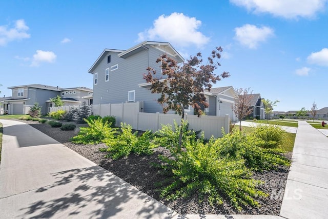 12524 W Shortcreek, Star, ID 83669 - view of side of home featuring a residential view and a garage
