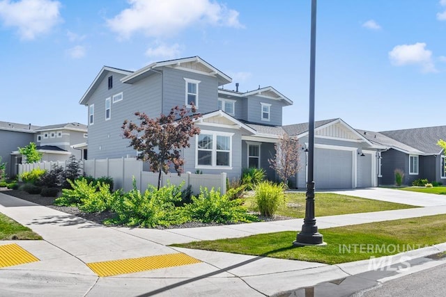 12524 W Shortcreek, Star, ID 83669 - view of front facade with board and batten siding, an attached garage, concrete driveway, and a residential view