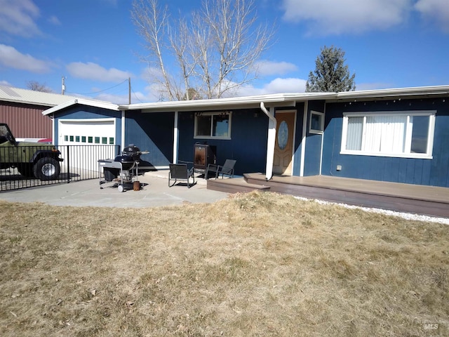 ranch-style home with a patio area and fence