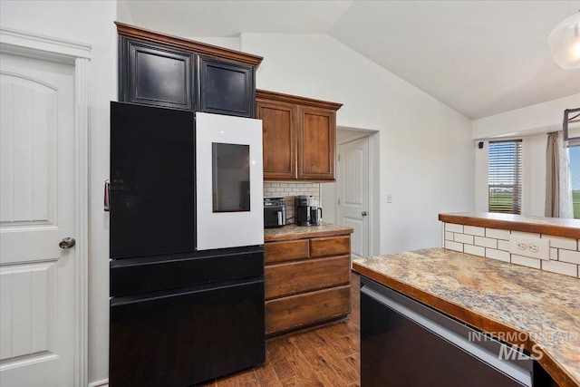 23 N 950 E, Declo, ID 83323 - kitchen with light countertops, dark wood-type flooring, backsplash, refrigerator, and vaulted ceiling