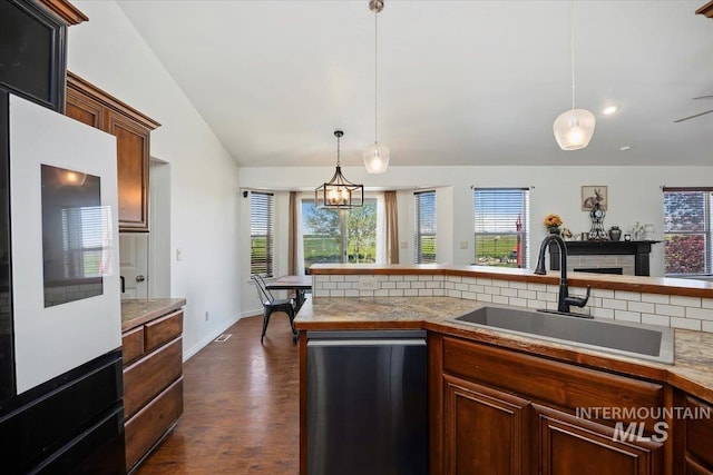 23 N 950 E, Declo, ID 83323 - kitchen with backsplash, stainless steel dishwasher, a sink, and light countertops