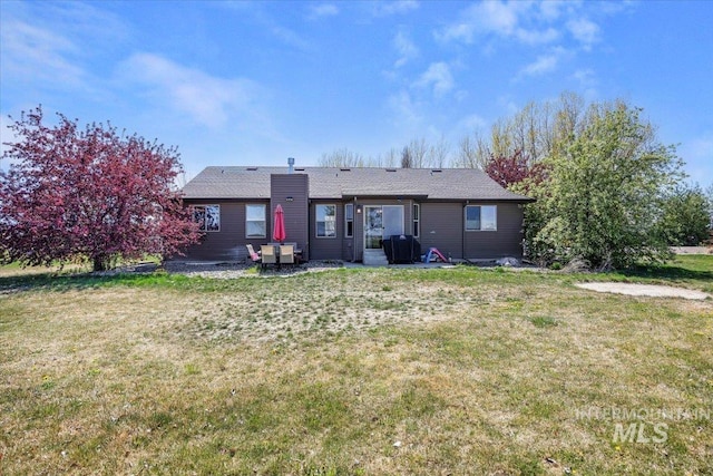 23 N 950 E, Declo, ID 83323 - back of property with a yard, a patio, and a chimney