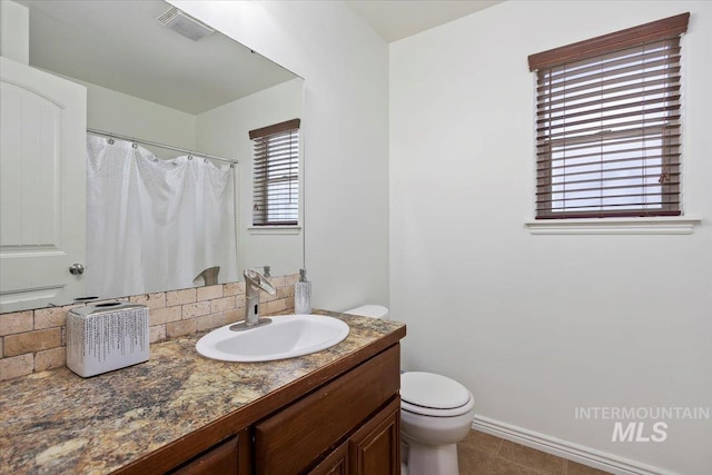 23 N 950 E, Declo, ID 83323 - bathroom featuring vanity, toilet, curtained shower, and visible vents