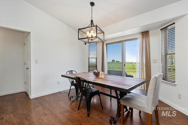 23 N 950 E, Declo, ID 83323 - dining room featuring baseboards, visible vents, dark wood-style floors, and a chandelier