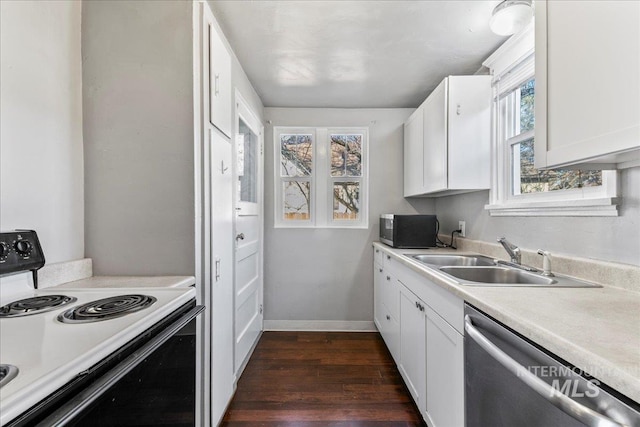 kitchen with dark wood finished floors, dishwasher, range with electric stovetop, white cabinetry, and a sink