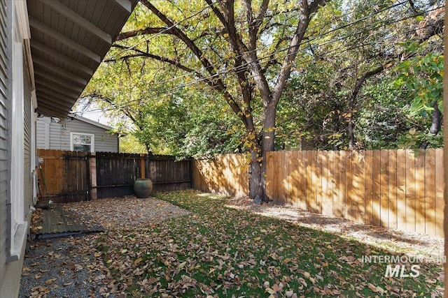 view of yard with a fenced backyard