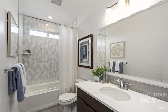 full bathroom featuring shower / tub combo with curtain, vanity, and toilet