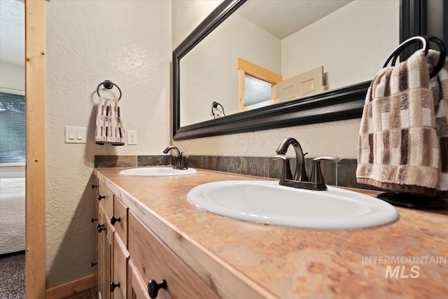 23 Waterline Ln, Cascade, ID 83611 - full bath featuring a textured wall and double vanity