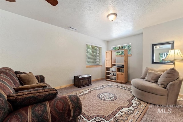 23 Waterline Ln, Cascade, ID 83611 - living room featuring a ceiling fan, light colored carpet, and a textured ceiling