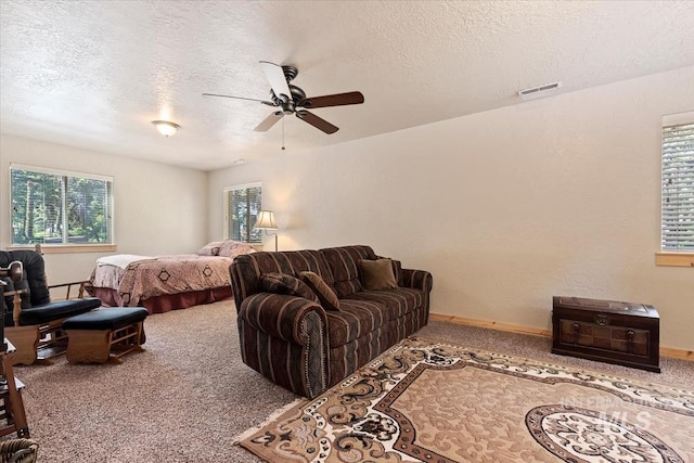 23 Waterline Ln, Cascade, ID 83611 - bedroom with carpet flooring, a textured ceiling, and a ceiling fan