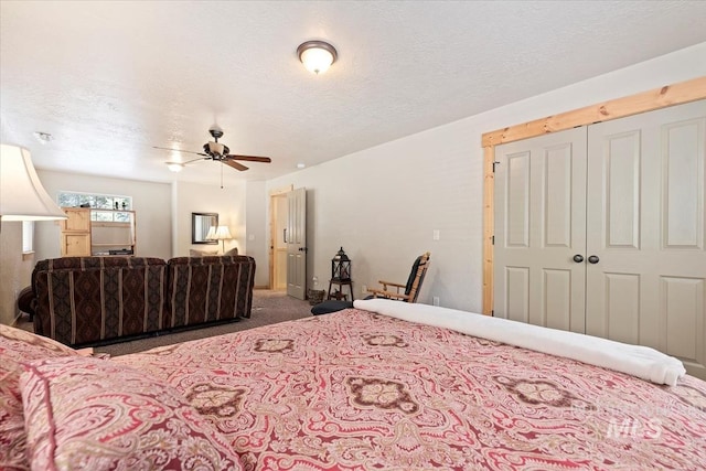 23 Waterline Ln, Cascade, ID 83611 - bedroom featuring carpet floors, a textured ceiling, a closet, and a ceiling fan