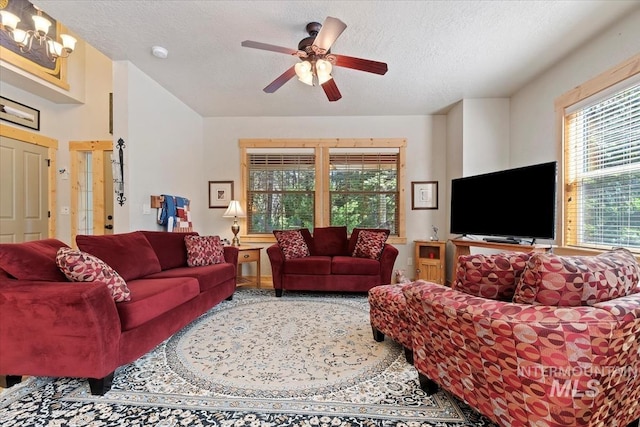 23 Waterline Ln, Cascade, ID 83611 - living room featuring a textured ceiling, ceiling fan, and a chandelier