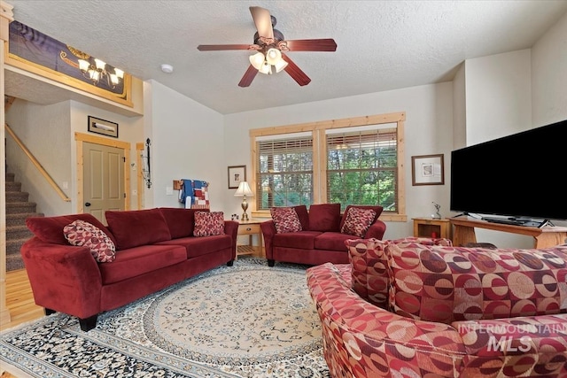 23 Waterline Ln, Cascade, ID 83611 - living area with stairs, a textured ceiling, and ceiling fan