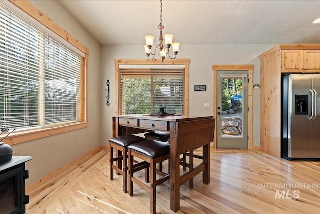 23 Waterline Ln, Cascade, ID 83611 - dining space featuring a chandelier and light wood-style floors