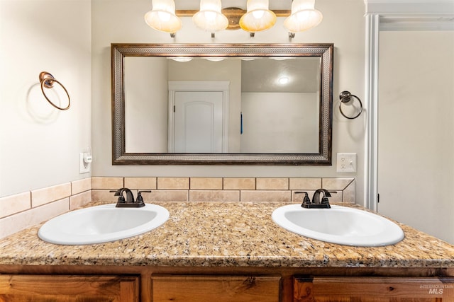 full bathroom featuring a sink and double vanity